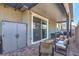 Outdoor patio with dining and seating areas, creating an inviting space for outdoor relaxation at 3778 Via Gennaro, Henderson, NV 89044