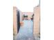 Cozy backyard entrance with stone pavers, brick columns, and a secure metal gate, leading to outdoor enjoyment at 4178 Eagle Island St, Las Vegas, NV 89130
