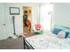Bedroom featuring a metal bed frame, a small chair, and a walk-in closet at 4178 Eagle Island St, Las Vegas, NV 89130