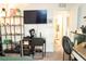 Bedroom with desk, shelving unit with toys, fish tank, and access to a bathroom at 4178 Eagle Island St, Las Vegas, NV 89130