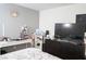 Bright bedroom featuring modern decor, a sleek dresser, and a stylish workspace with a desk at 4178 Eagle Island St, Las Vegas, NV 89130