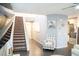 Spacious entryway showcasing staircase, elegant decor, and seamless access to living areas at 4178 Eagle Island St, Las Vegas, NV 89130