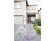 Inviting home exterior with a stone walkway, desert landscaping, covered porch and comfortable seating area at 4178 Eagle Island St, Las Vegas, NV 89130
