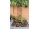 Small garden area with brick border, providing a perfect spot for planting flowers or herbs at 4178 Eagle Island St, Las Vegas, NV 89130