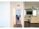 Open hallway connects the living room and bedroom spaces, enhancing the home's spacious layout at 4178 Eagle Island St, Las Vegas, NV 89130