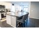 Kitchen featuring a spacious island with barstool seating and sleek countertops at 4178 Eagle Island St, Las Vegas, NV 89130