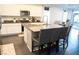 This kitchen features a spacious island with barstool seating and appliances, blending style and function at 4178 Eagle Island St, Las Vegas, NV 89130