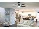 Bright living room with an open layout, ceiling fan and seamless connection to the kitchen at 4178 Eagle Island St, Las Vegas, NV 89130