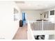 Carpeted loft area featuring bright white walls and a view of the downstairs living room at 4178 Eagle Island St, Las Vegas, NV 89130