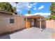 Back of home featuring covered patio, exterior storage box, and block wall at 4274 Rollingstone Dr, Las Vegas, NV 89103