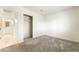 View of carpeted bedroom featuring closet and entrance to ensuite bathroom at 4274 Rollingstone Dr, Las Vegas, NV 89103