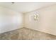This cozy bedroom has soft carpeting and a window for natural light at 4274 Rollingstone Dr, Las Vegas, NV 89103