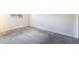 This carpeted bedroom has a window for natural light and outlets at 4274 Rollingstone Dr, Las Vegas, NV 89103