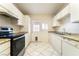 Classic kitchen with white cabinets, stainless steel appliances and granite countertops at 4274 Rollingstone Dr, Las Vegas, NV 89103