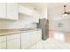 Bright kitchen with white cabinets and stainless steel appliances at 4274 Rollingstone Dr, Las Vegas, NV 89103