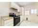 Bright kitchen with white cabinets, stainless steel appliances and granite countertops at 4274 Rollingstone Dr, Las Vegas, NV 89103