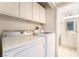 Laundry room with tile floor and view into ensuite bathroom at 4274 Rollingstone Dr, Las Vegas, NV 89103