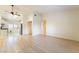 Bright living room with hardwood floors and an open floor plan to the kitchen at 4274 Rollingstone Dr, Las Vegas, NV 89103