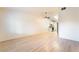 Bright living room with hardwood floors and an open floor plan to the kitchen at 4274 Rollingstone Dr, Las Vegas, NV 89103