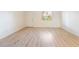 Bright living room with hardwood floors and a window letting in natural light at 4274 Rollingstone Dr, Las Vegas, NV 89103