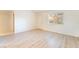 Bright living room with hardwood floors and a window letting in natural light at 4274 Rollingstone Dr, Las Vegas, NV 89103