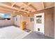 Covered patio with white door, exterior storage box and block wall at 4274 Rollingstone Dr, Las Vegas, NV 89103