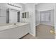 Bathroom with modern vanity and fixtures, as well as an entrance to the bedroom at 4400 W Lake Mead Blvd # 101, Las Vegas, NV 89108