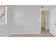 An empty bedroom features a window, light gray paint, and luxury vinyl plank flooring at 4400 W Lake Mead Blvd # 101, Las Vegas, NV 89108