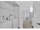 Laundry room with modern appliances and storage with access to the hallway at 4400 W Lake Mead Blvd # 101, Las Vegas, NV 89108