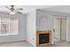 Inviting living room boasts a ceiling fan, fireplace and sliding doors to a balcony at 4400 W Lake Mead Blvd # 101, Las Vegas, NV 89108