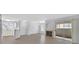 Spacious living area with fireplace, ceiling fan and access to the outdoors at 4400 W Lake Mead Blvd # 101, Las Vegas, NV 89108