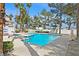 The community pool is surrounded by lush trees and tall palms, ideal for outdoor relaxation at 4400 W Lake Mead Blvd # 101, Las Vegas, NV 89108