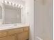 Bright bathroom showcasing a vanity with great lighting and a shower-tub combo at 5249 Wave Dancer Ln, Las Vegas, NV 89118