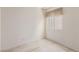 Simple, carpeted bedroom with a window and neutral walls, ready for personalization at 5249 Wave Dancer Ln, Las Vegas, NV 89118