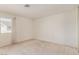 Spacious bedroom with neutral carpeting, window providing natural light, and blank canvas to customize at 5249 Wave Dancer Ln, Las Vegas, NV 89118