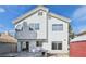 Exterior of home showcasing backyard, patio, the yard with a large tree, and a storage shed at 5636 Royal Castle Ln, Las Vegas, NV 89130