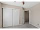 Bedroom with carpeted floor, neutral walls, and sliding door closet at 5636 Royal Castle Ln, Las Vegas, NV 89130
