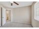 A cozy bedroom featuring neutral tones, carpet flooring and natural light from window at 5636 Royal Castle Ln, Las Vegas, NV 89130