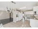 Open kitchen featuring tile floors, modern lighting, and eat-in dining at 5636 Royal Castle Ln, Las Vegas, NV 89130