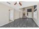 Inviting living room showcasing tile flooring, neutral paint, a staircase, and an open floor plan at 5636 Royal Castle Ln, Las Vegas, NV 89130
