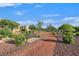 Beautiful community park with landscaped walkways, seating, and greenery, offering a tranquil environment at 5717 Heineken Dr, North Las Vegas, NV 89031
