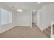 Open living space with carpet and a chandelier visible from the dining area at 5717 Heineken Dr, North Las Vegas, NV 89031