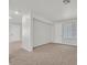 Spacious carpeted living room with access to doorways and plenty of natural light at 5717 Heineken Dr, North Las Vegas, NV 89031