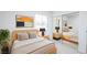 Cozy bedroom features neutral tones, a sliding mirrored closet, and a bright window at 6170 W University Ave, Las Vegas, NV 89103