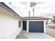 Exterior view of a home with a gray garage door and solar panels on the roof at 6170 W University Ave, Las Vegas, NV 89103