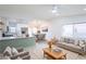 Bright and airy living room featuring an open floor plan and modern furnishings at 6170 W University Ave, Las Vegas, NV 89103