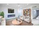 Cozy living room with a modern fireplace, comfortable seating, and a built-in bookcase at 6170 W University Ave, Las Vegas, NV 89103