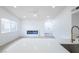 Modern living room boasts a sleek electric fireplace and light wood-look flooring at 6170 W University Ave, Las Vegas, NV 89103