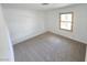 Carpeted bedroom with a window offering natural light at 6284 Explorer Dr, Las Vegas, NV 89103