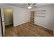 Bedroom with wood-look flooring and built-in storage shelves at 6284 Explorer Dr, Las Vegas, NV 89103
